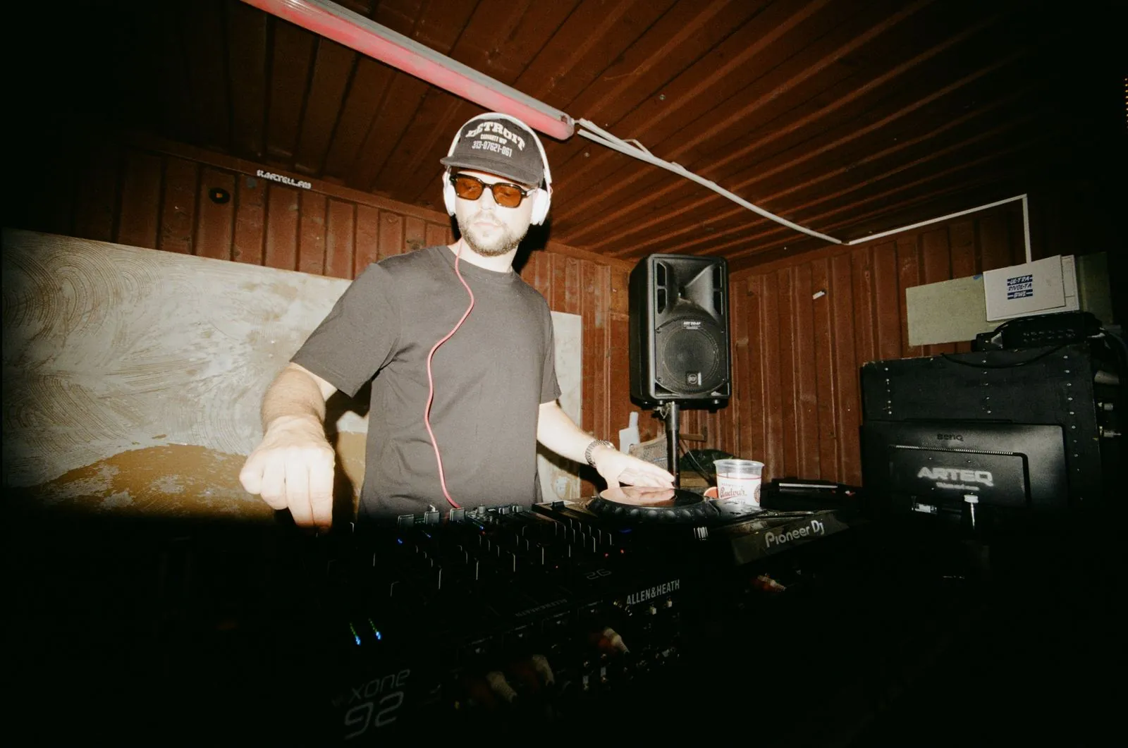 Annex behind the decks in sunglasses
